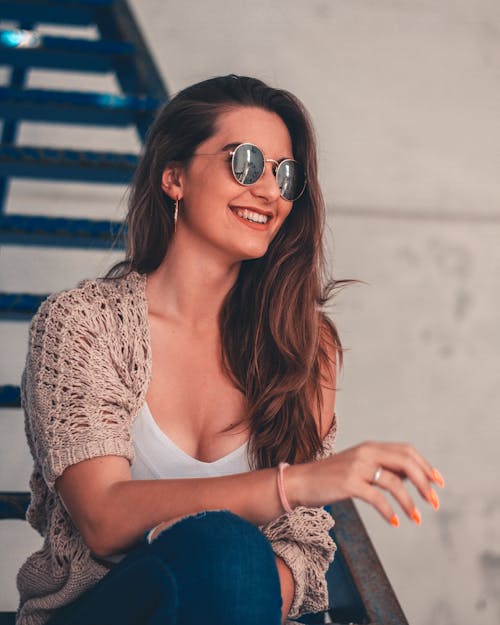 Free Woman Smiling on Stairs Stock Photo