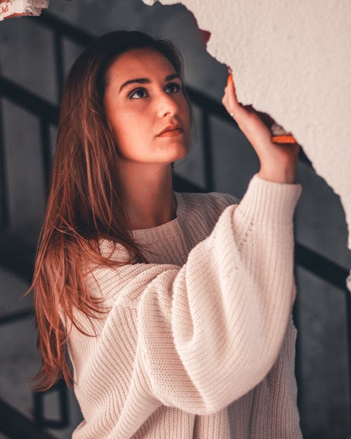 Free Woman Holding Wall Stock Photo