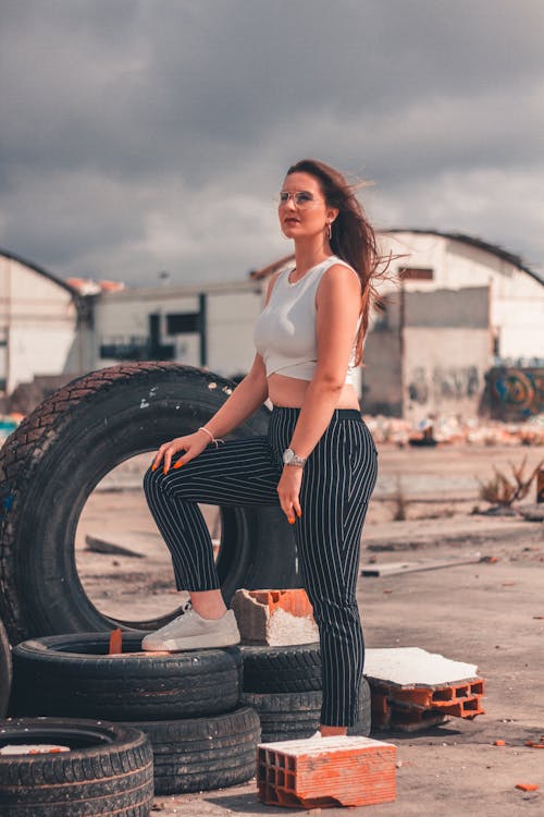 Woman Standing on Vehicle Tire