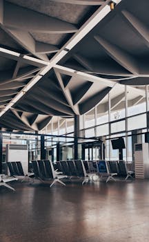 Spacious and empty seating area in a modern airport lobby in Tanzania. Architecture focus.