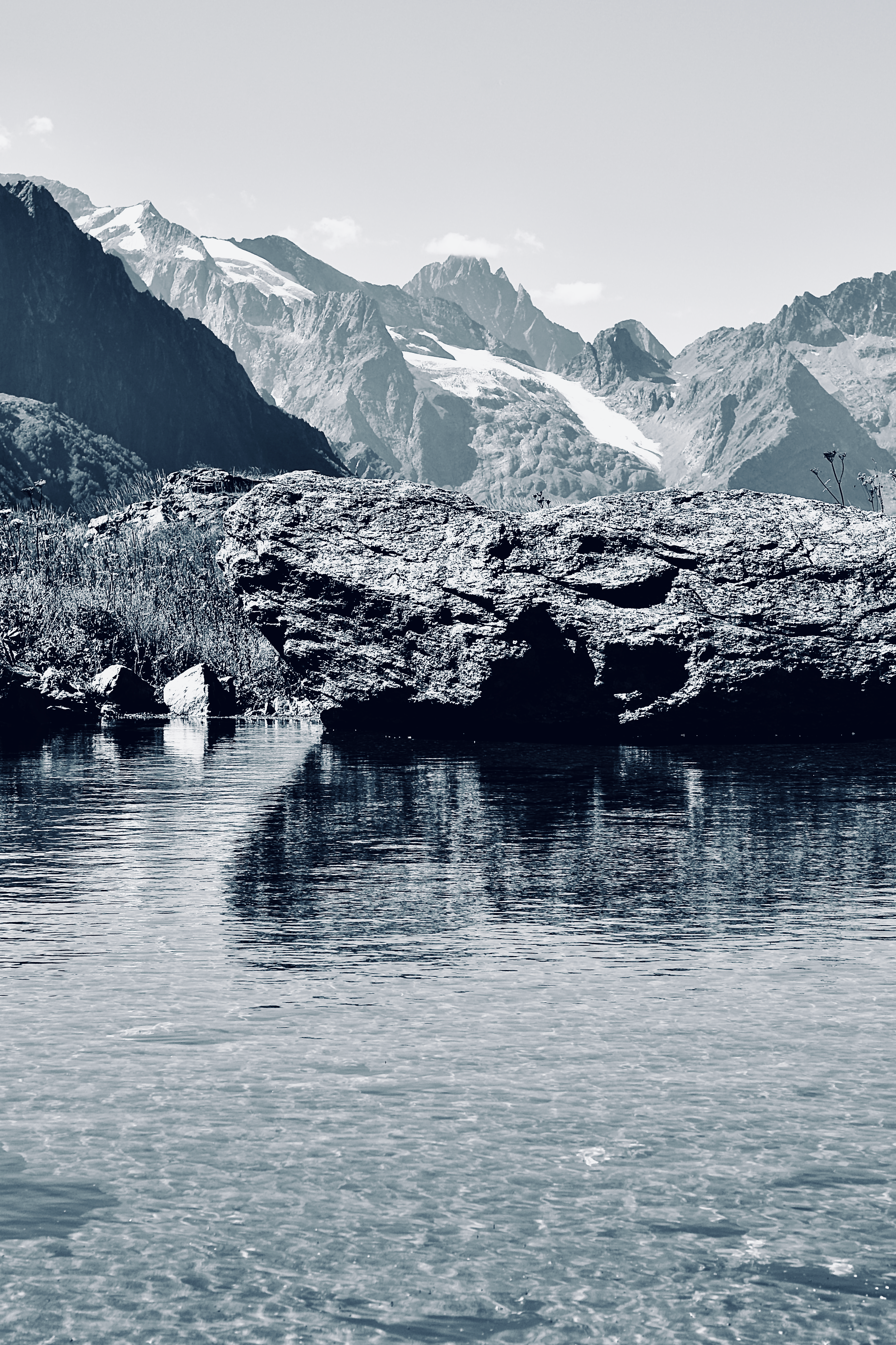 Black and White Photo of a Landscape with a Lake and Distant Mountains ...