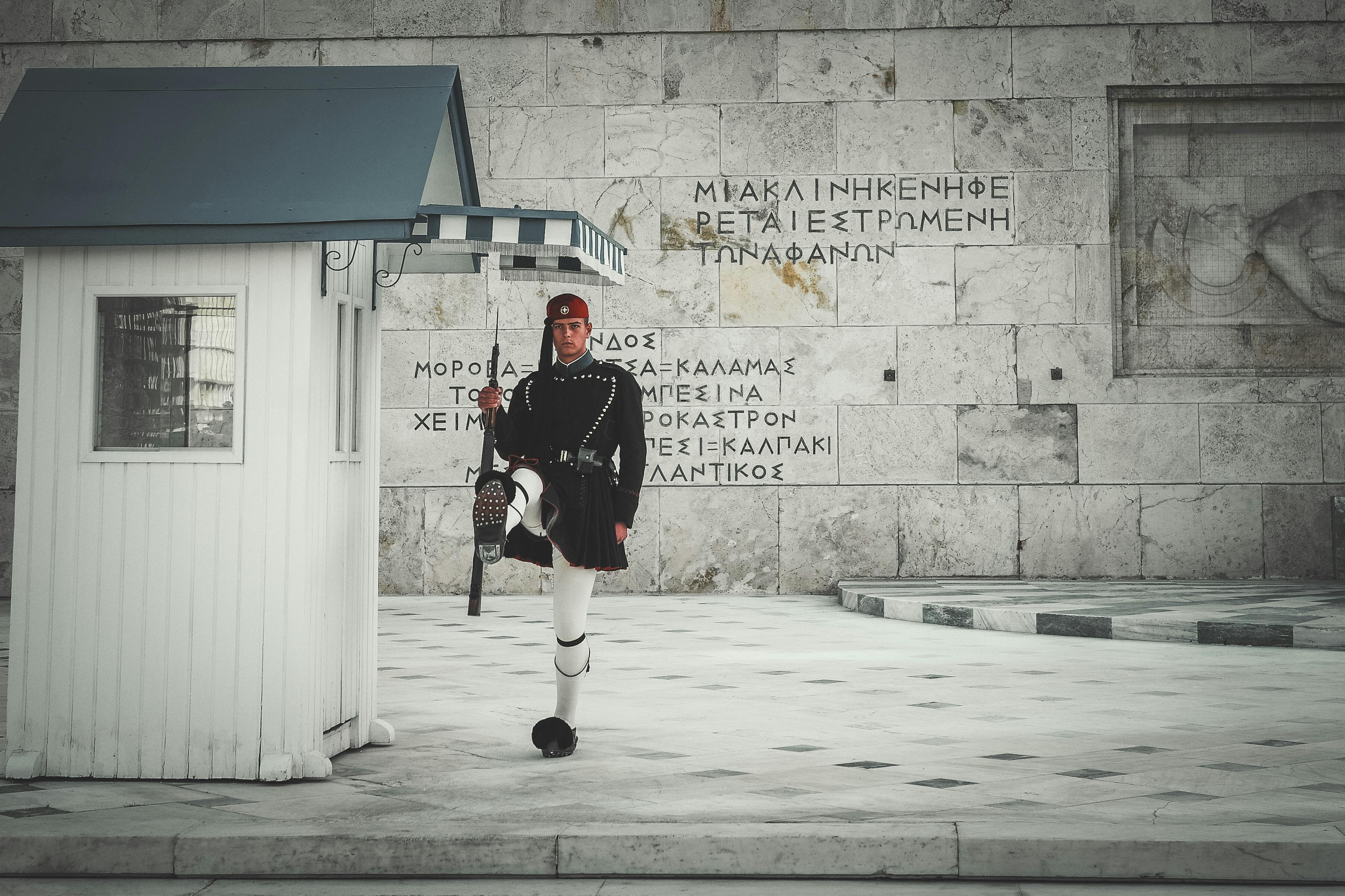 Evzone soldier in ceremonial uniform at Athens' Tomb of the Unknown Soldier, Greece.