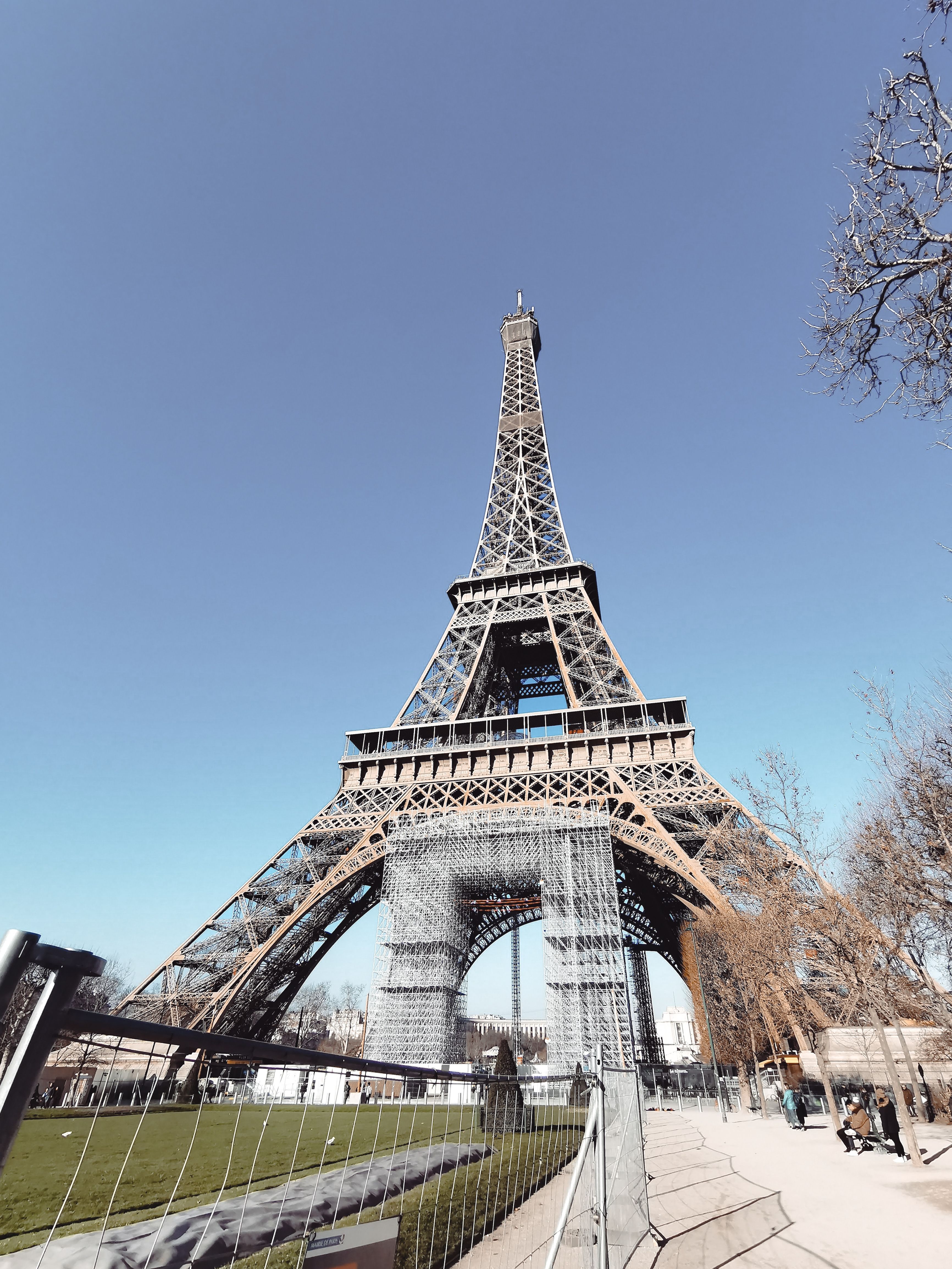 A Low Angle Shot of a Tower Under the Blue Sky · Free Stock Photo