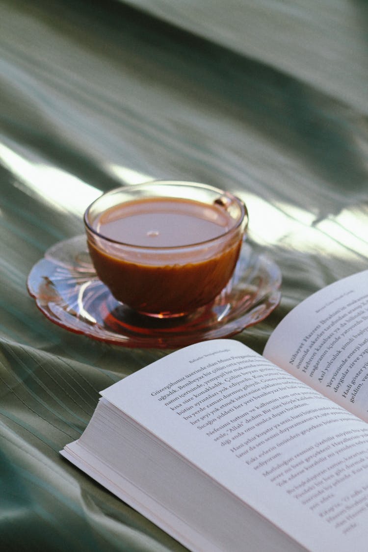 Coffee And Book On Textile Background