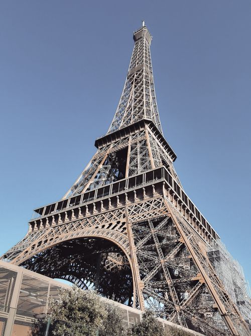 Free Stunning view of the Eiffel Tower in Paris, captured on a clear day, showcasing its architectural beauty. Stock Photo
