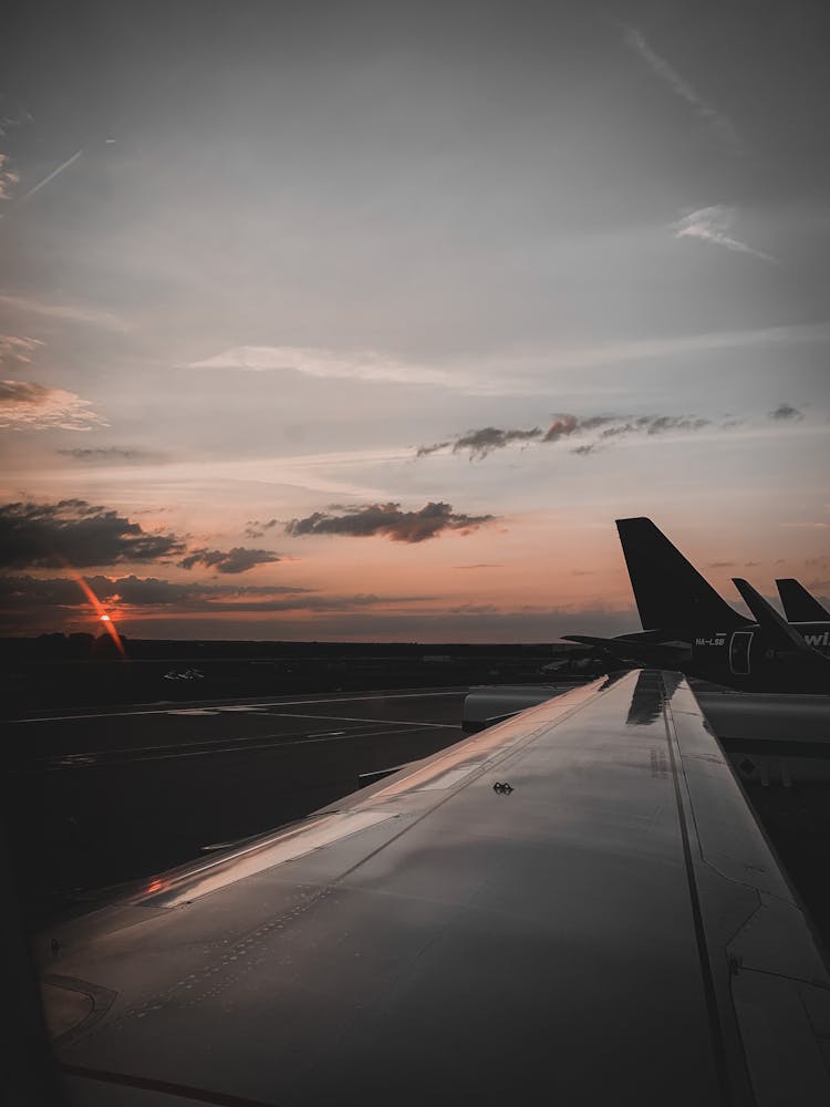 Airplanes At An Airport Runway