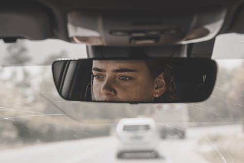 Woman in Rear Mirror Reflection