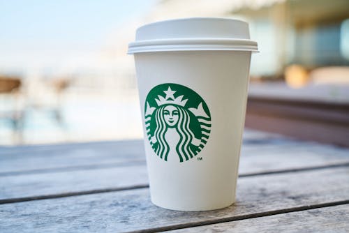 Closed White and Green Starbucks Disposable Cup