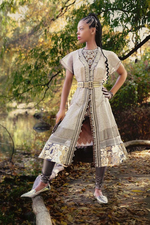 Woman Posing in Traditional Gown