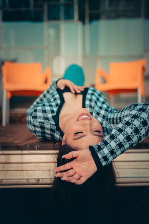 Beautiful Woman Lying on her Back and Smiling 