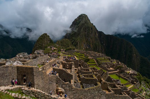 Explore the stunning ancient Incan ruins of Machu Picchu nestled in the Andes of Peru.