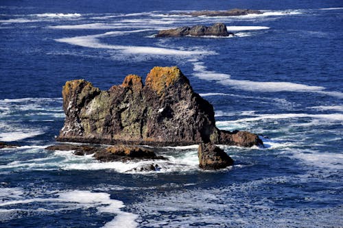 Sapphire Blue Sea and Rough Rocks