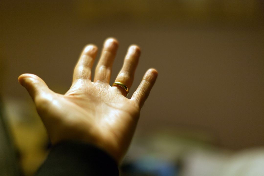which hand do men wear wedding ring — plain gold band on a man's ring finger — FoundryCut