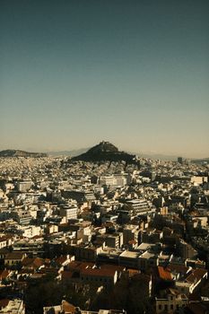 Discover breathtaking Athens cityscape with Mount Lycabettus at sunrise.