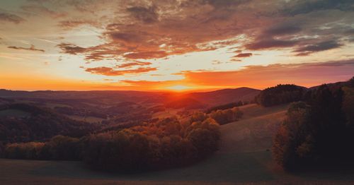 Free Beautiful panoramic sunset over the rolling hills and lush forests of Steiermark, Austria. Stock Photo