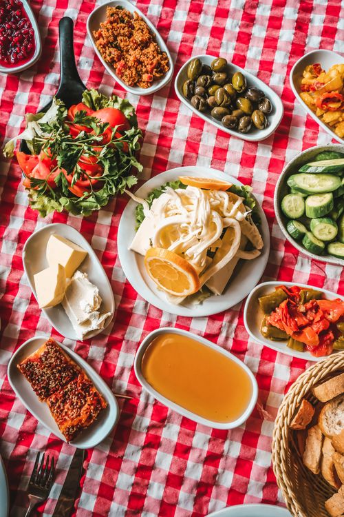 Free Delicious assortment of Turkish meze on a checkered tablecloth, showcasing vibrant colors and textures. Stock Photo
