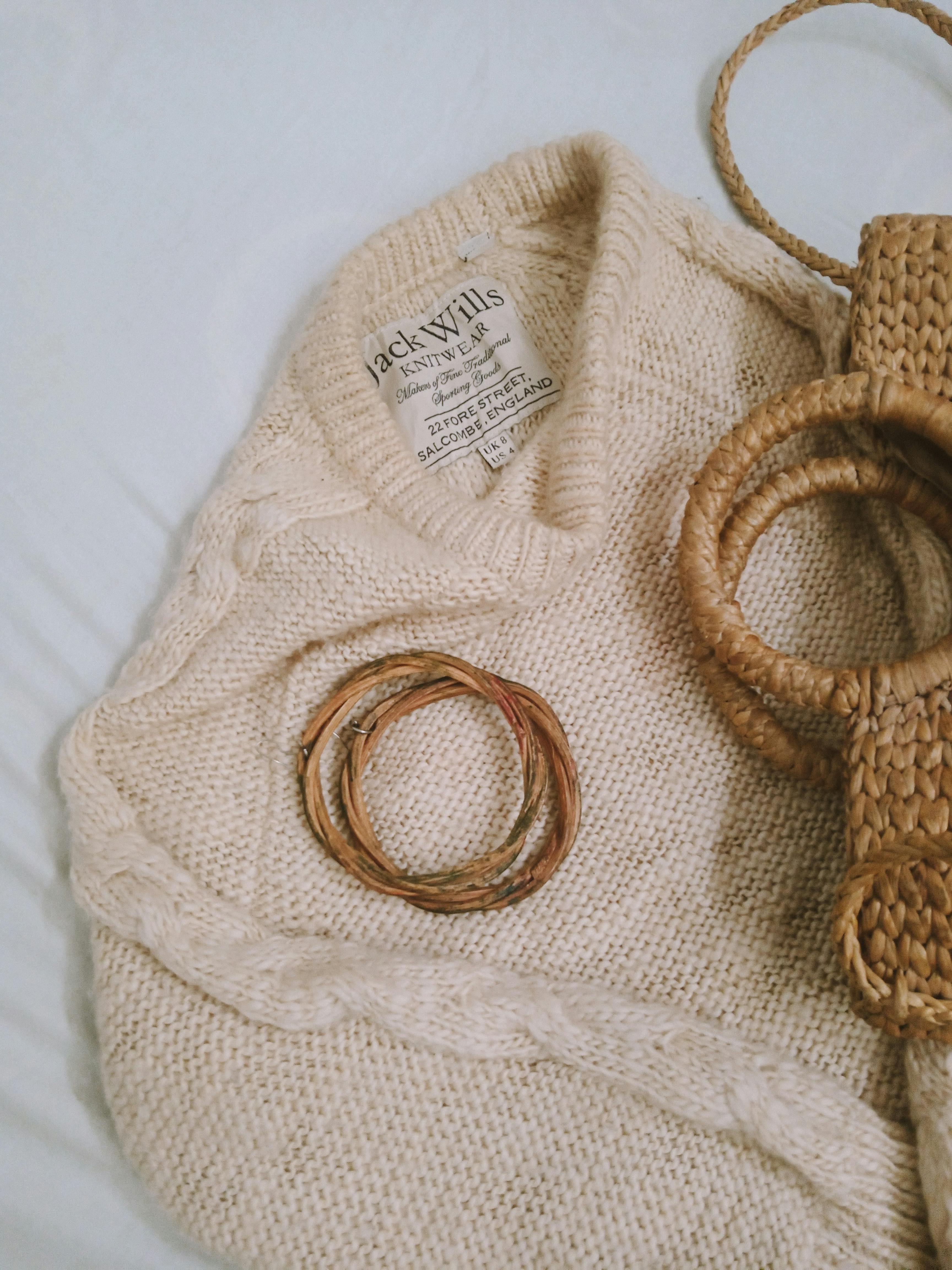 Gold Accessory on Brown Knit Textile · Free Stock Photo