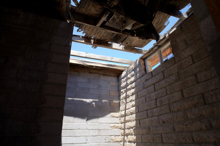 Brown Brick Building With Broken Ceiling