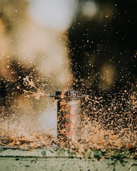 Capture of coffee splashing from an Aeropress in an outdoor setting, highlighting motion and energy.