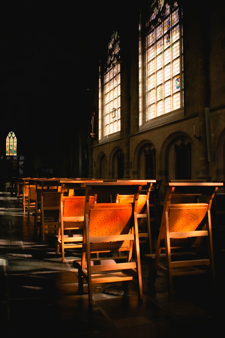 Wooden Chairs Under The Stained Glass Windows Of The St Willibrordus Basilica In Hulst Netherlands