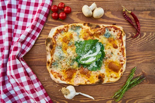 Pizza On Plate on Table · Free Stock Photo