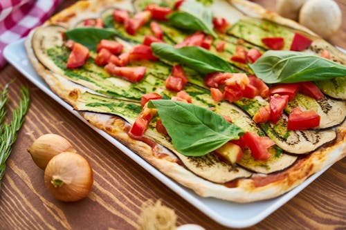 Free Baked Eggplant With Sliced Tomatoes and Spinach Stock Photo