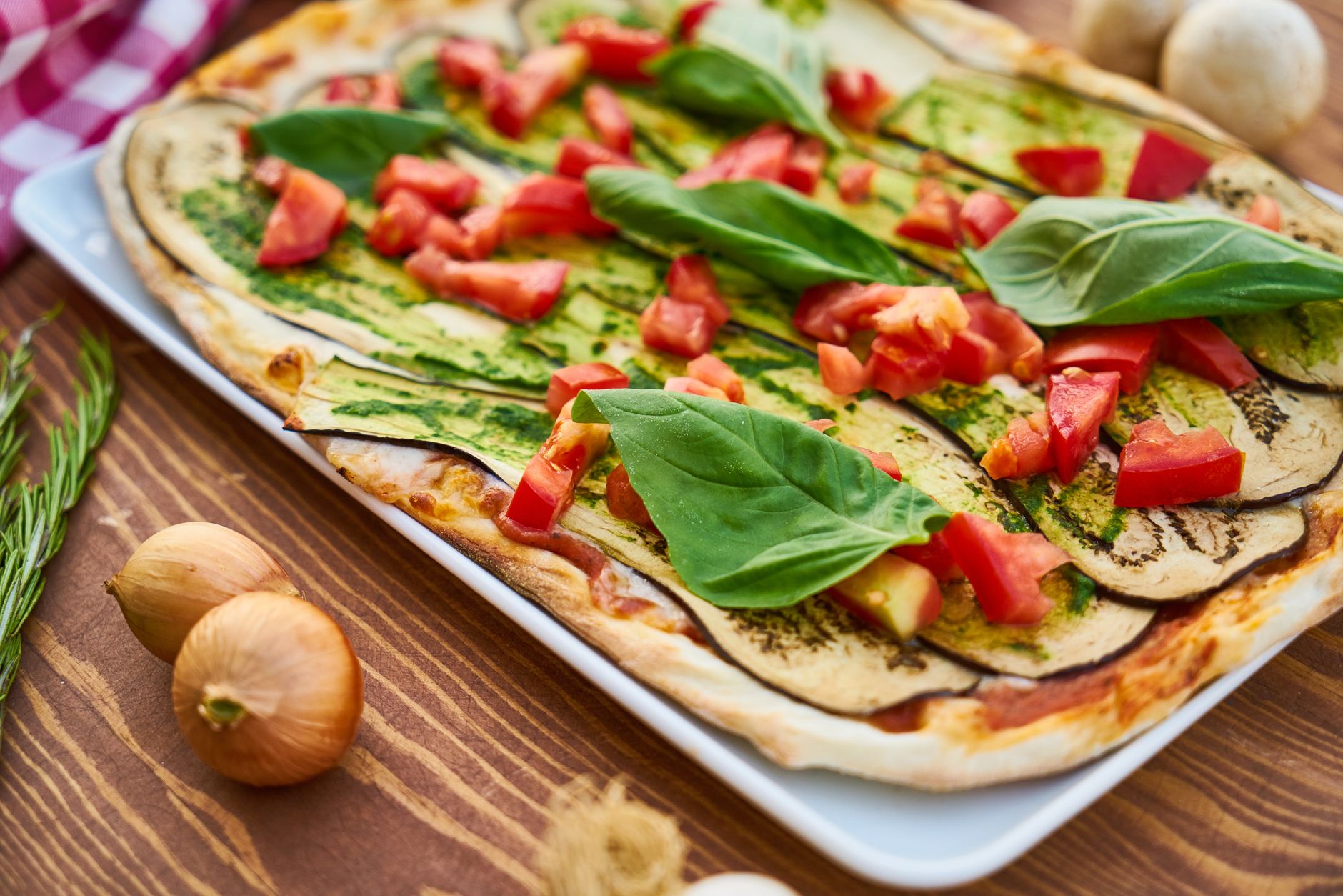 Your Ultimate Weekly Meal Plan for Stress-Free Dinners Delicious vegetable pizza featuring fresh eggplant, basil, and tomatoes for a healthy meal.