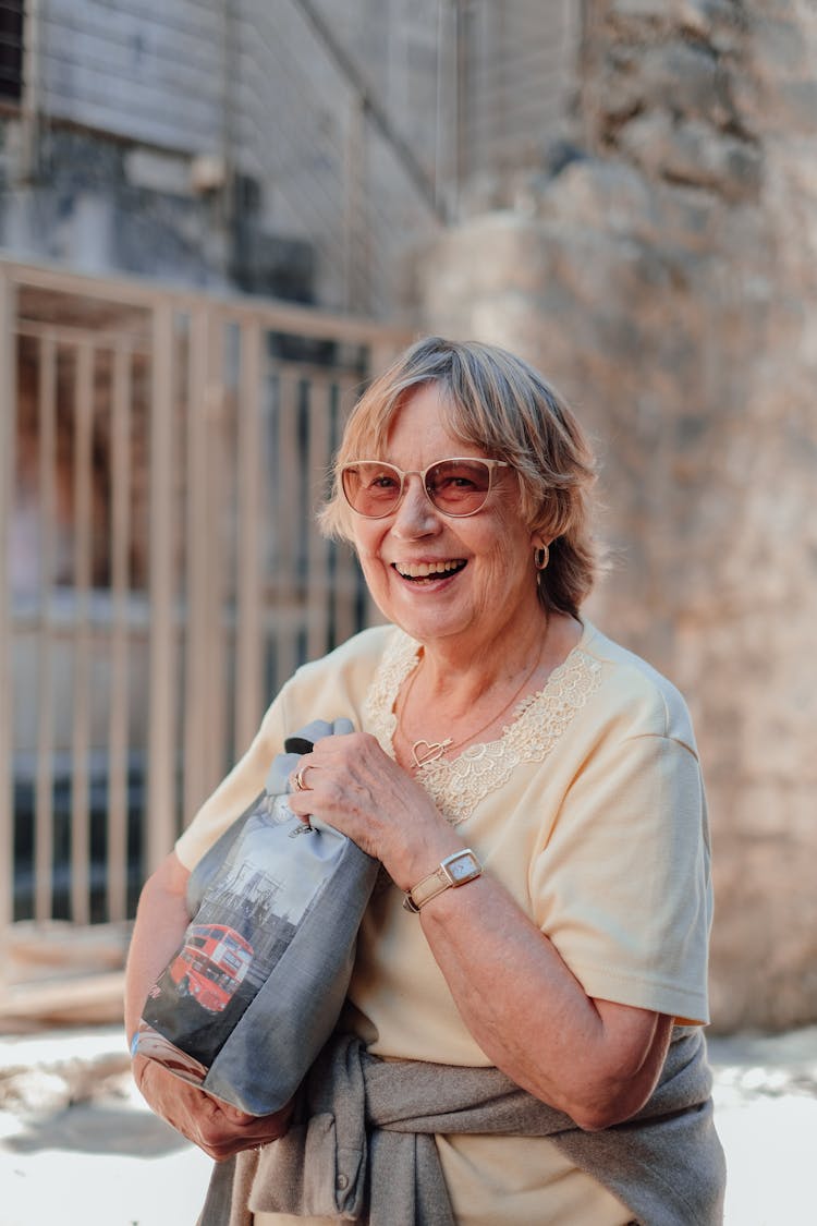 A Woman Holding Gray Bag