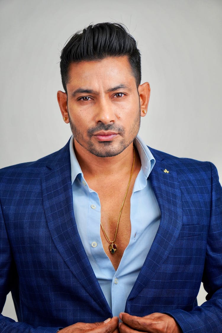 Portrait Of Handsome Man In Suit In Studio