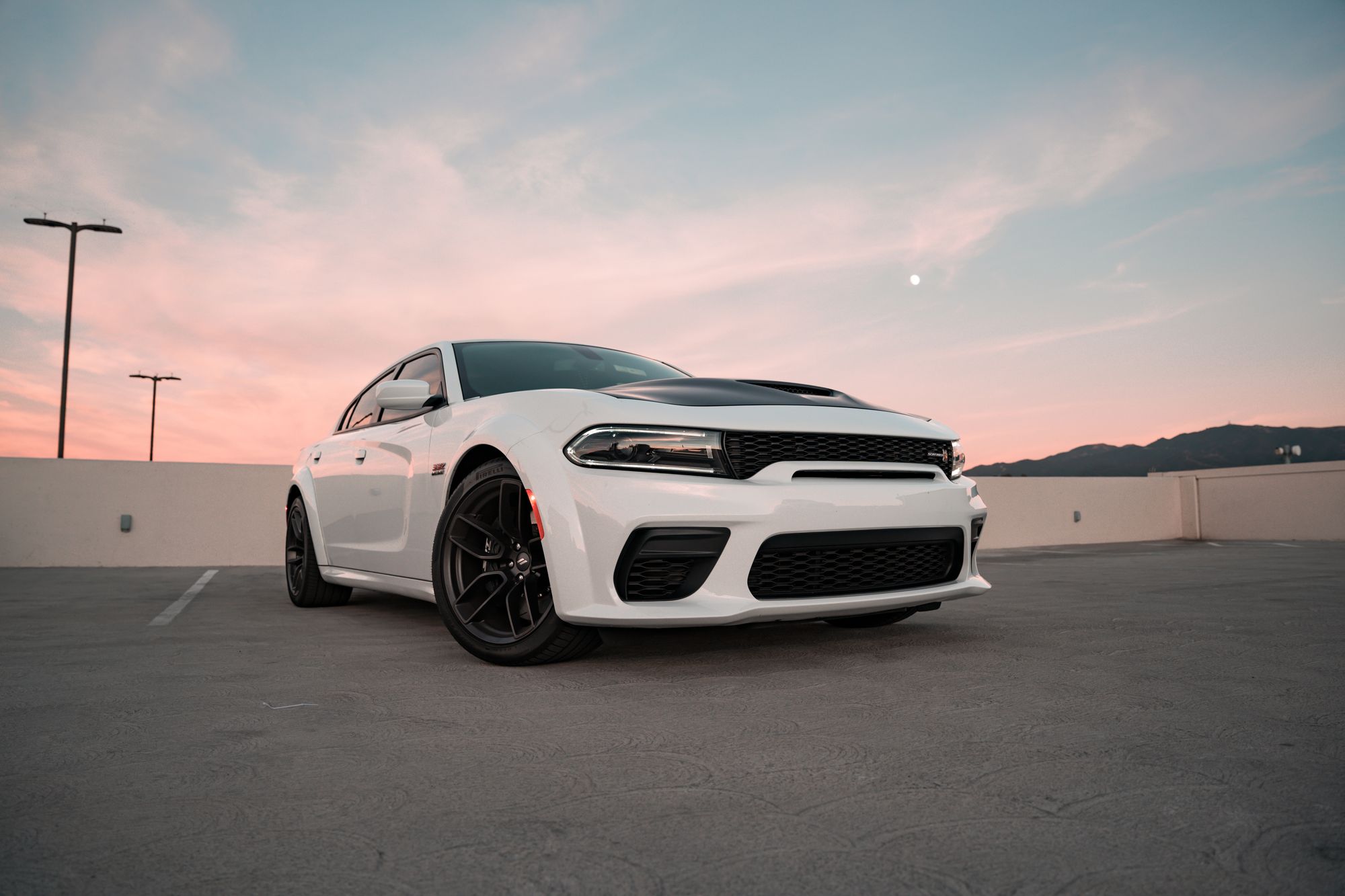 The Dodge Charger SRT Hellcat is explicitly named in the section as a Trackhawk comparison vehicle, making this directly…