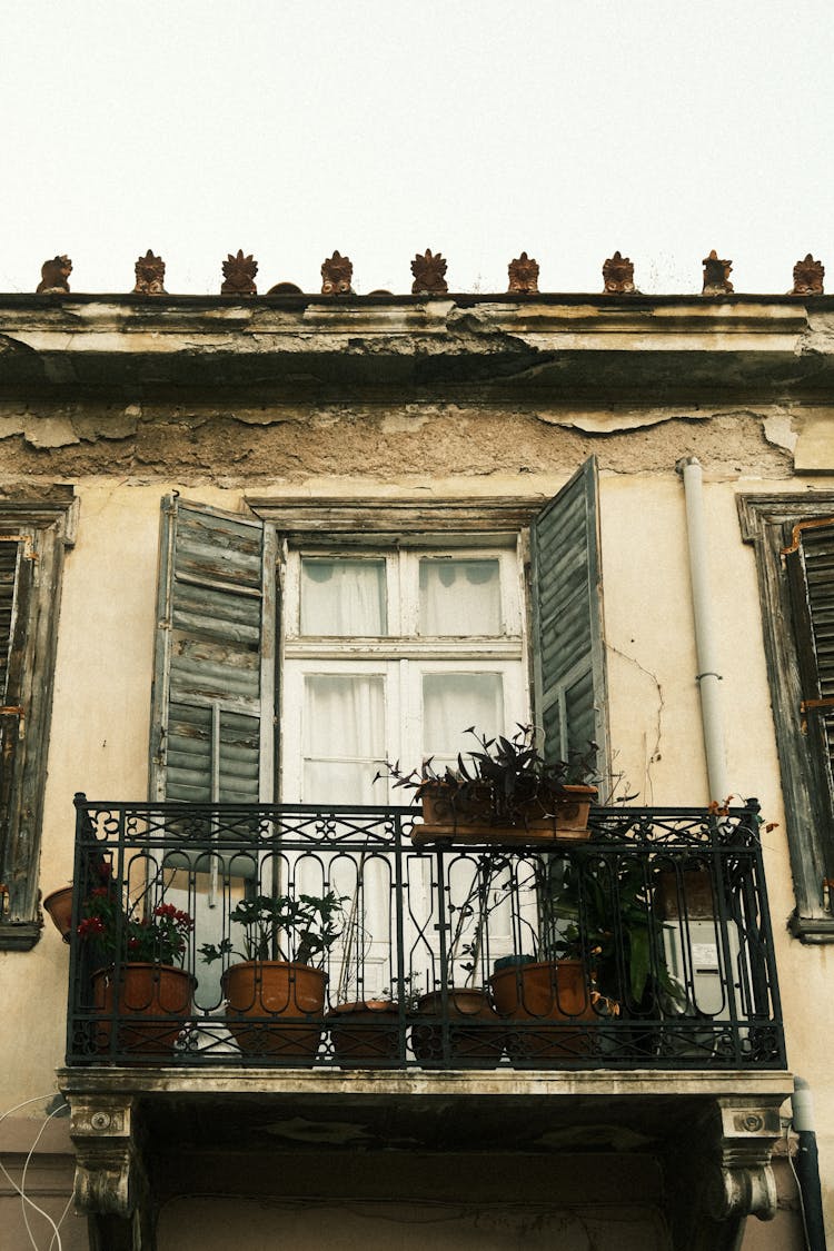 Balcony With Plants On Old House 