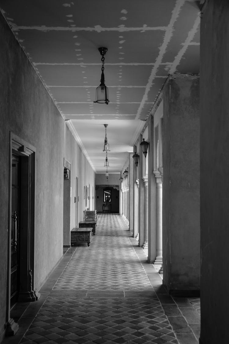 Grayscale Photo Of Hallway