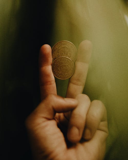 Coins between Index and Middle Finger