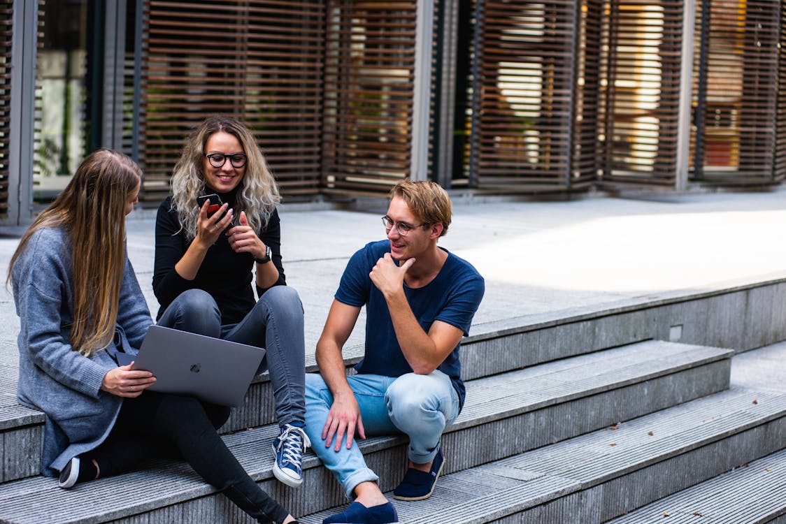 Photo by Buro Millennial from Pexels: https://www.pexels.com/photo/three-persons-sitting-on-the-stairs-talking-with-each-other-1438072/