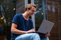 Selective Focus Photo of Man Using Laptop