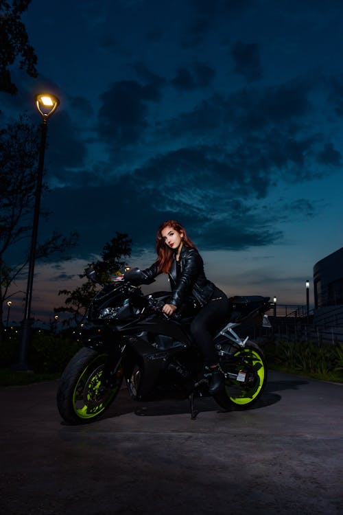 Woman Sitting on a Motorbike 