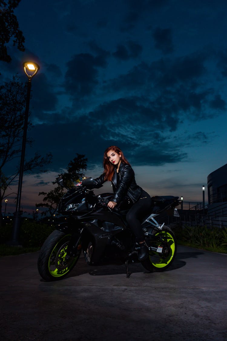 Woman Sitting On A Motorbike 