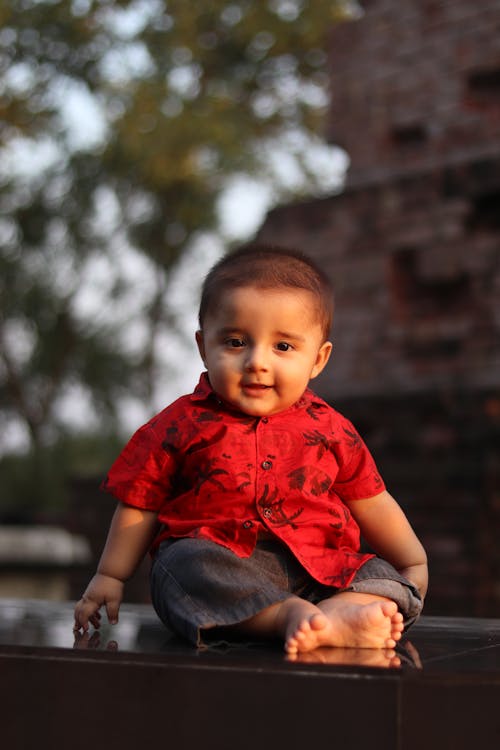 Photo of a Baby Boy in a Red Shirt 