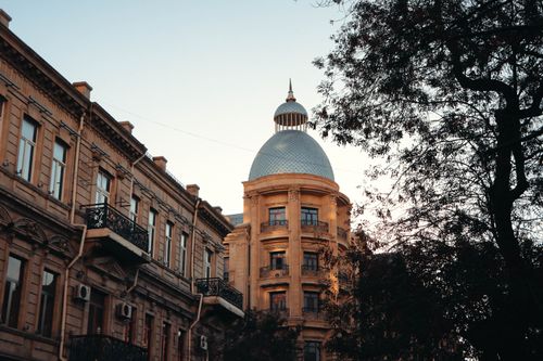 Free An elegant dome and historic buildings in Baku, captured during a clear day. Stock Photo
