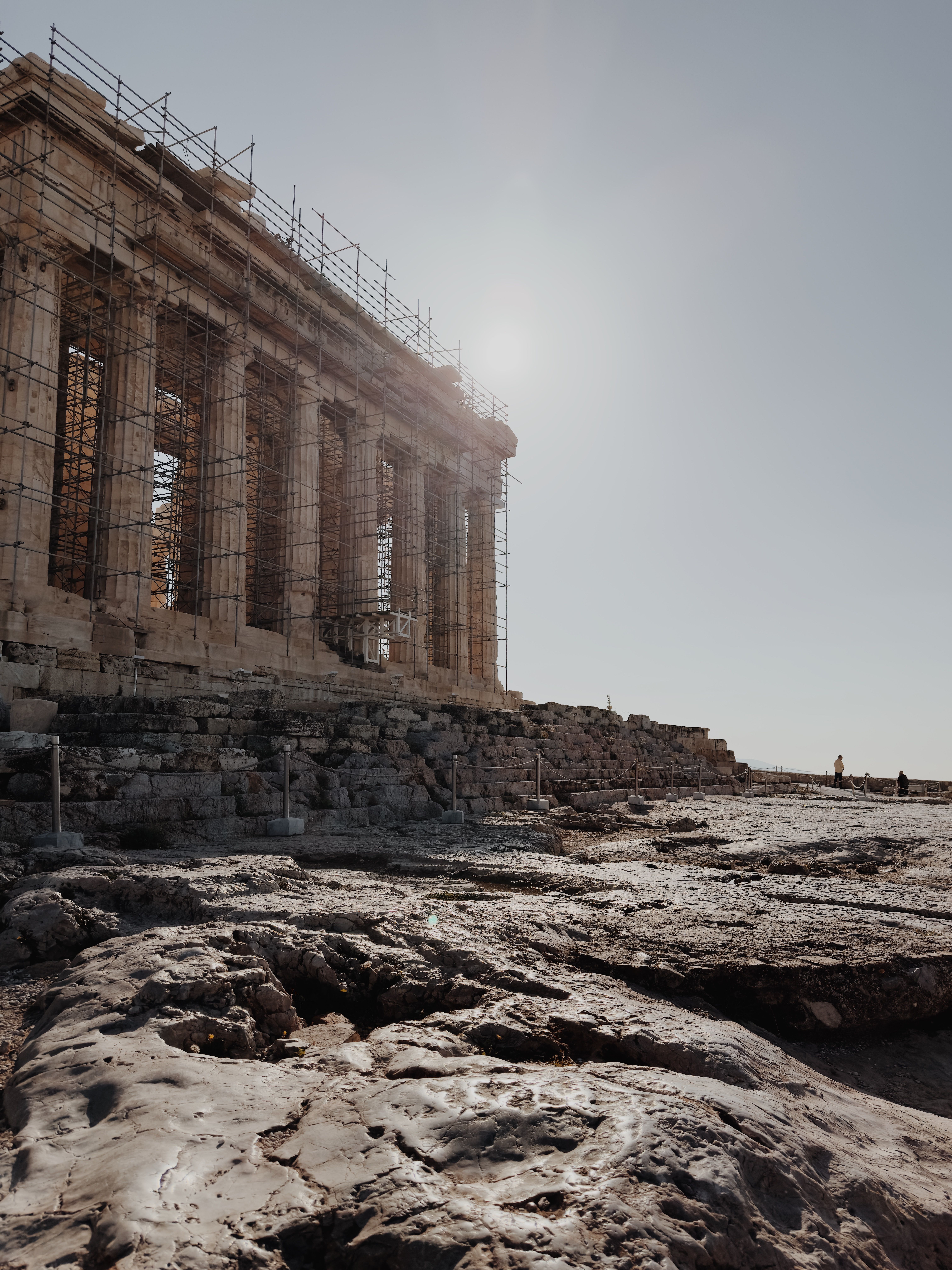 Historic Parthenon ruins in clear daylight with scaffolding for restoration, Athens, Greece.