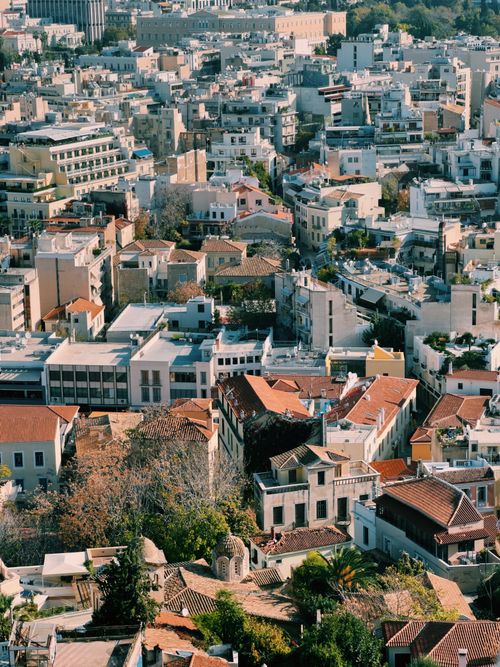Free Scenic high-angle aerial view of a vibrant Mediterranean urban townscape with mixed architecture. Stock Photo