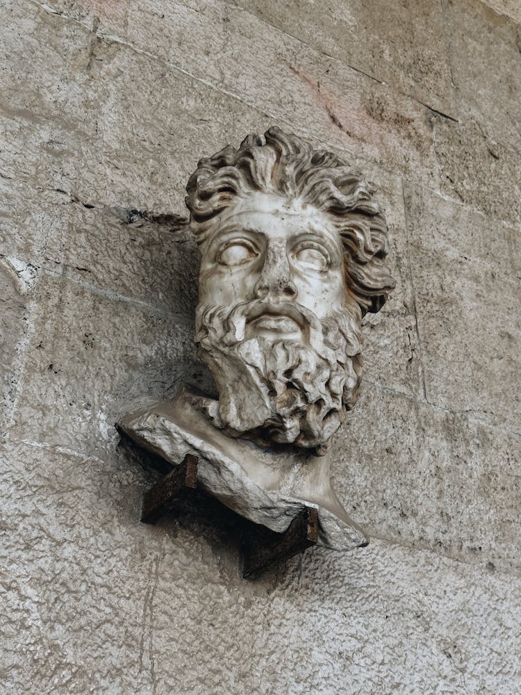 Sculpture Of Head On Wall