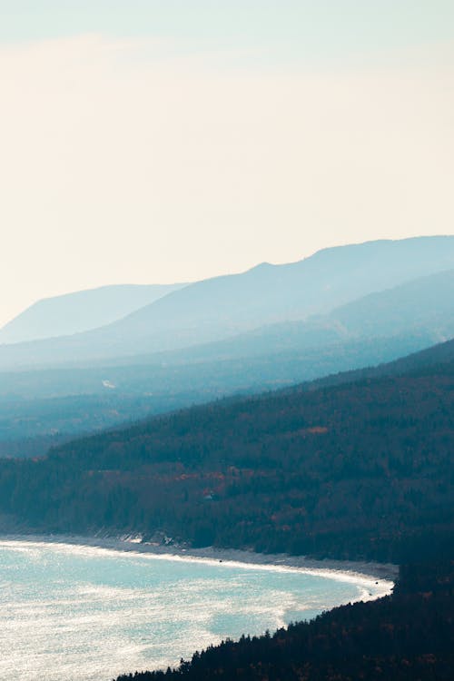 An Aerial Photography of a Mountain Near the Body of Water