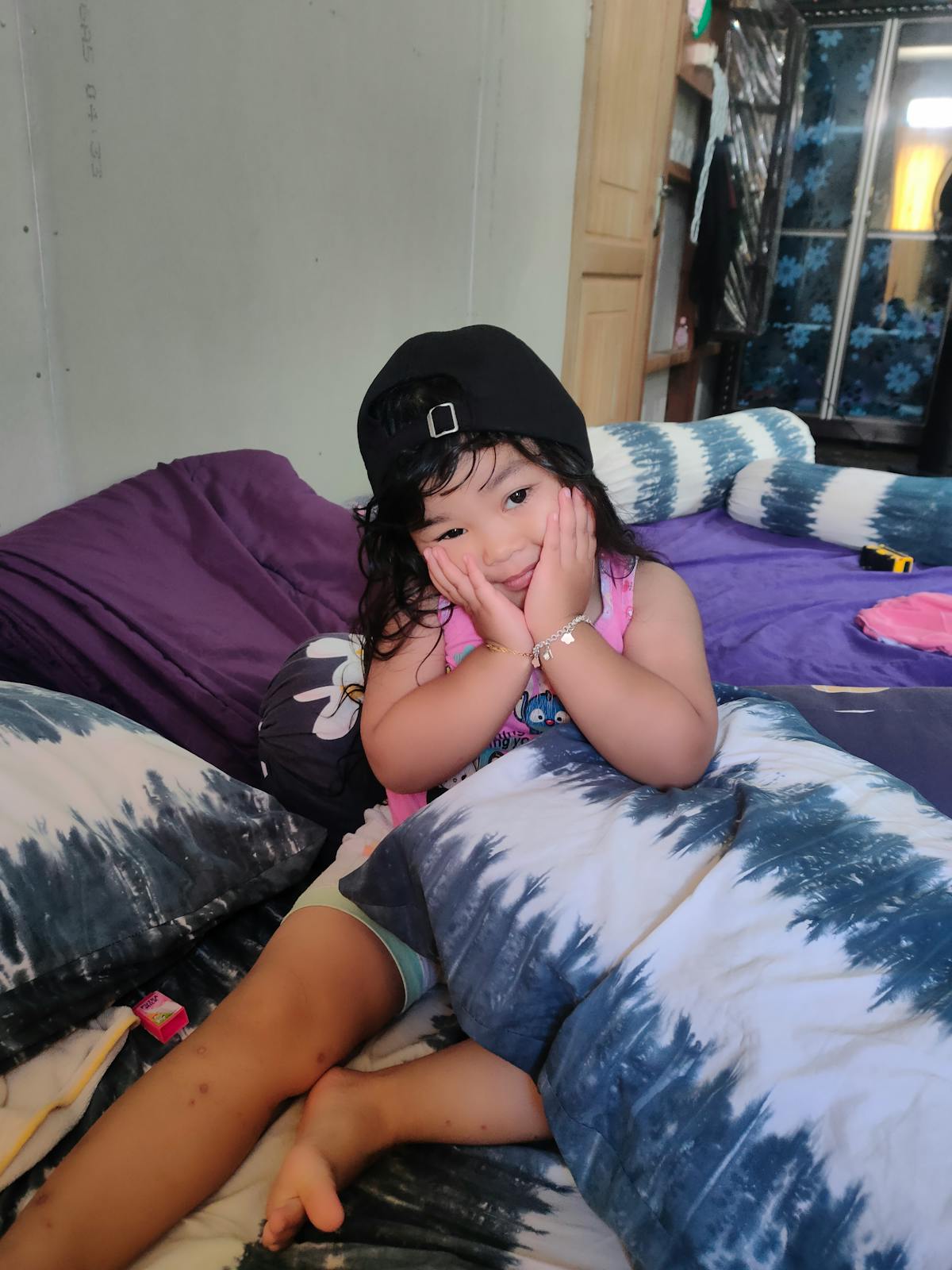 Foamy mushroom latte in a glass mug topped with cinnamon, surrounded by coffee beans and spices