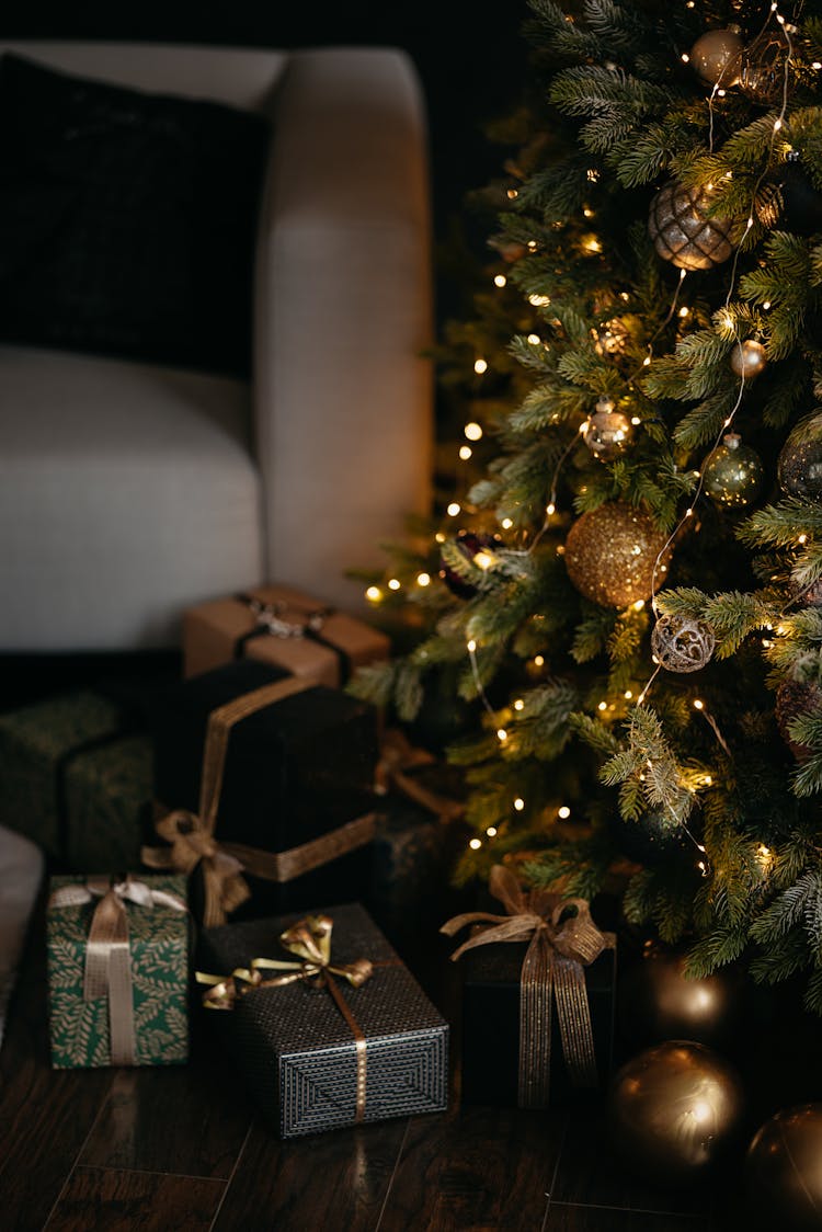 Gifts Under The Christmas Tree By An Armchair