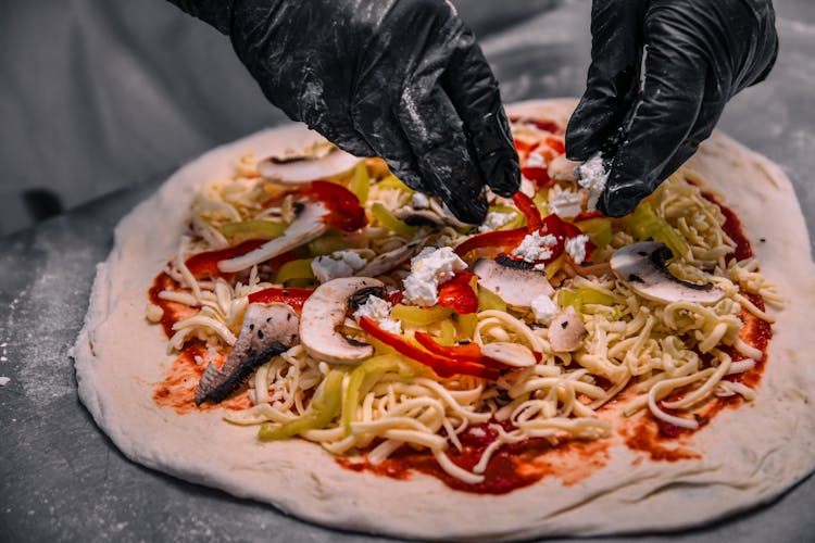 Person Making A Pizza