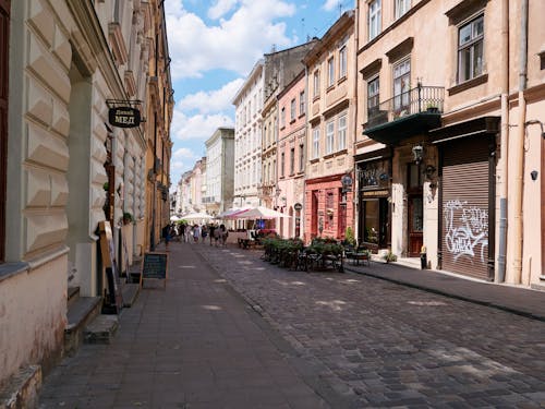 Cobblestone Alley between Buildings in the Old Town 