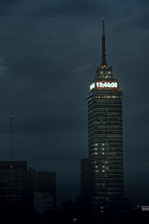 Illuminated Digital Clock on Top of a Building