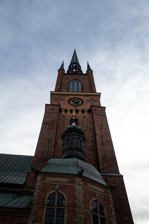 Gothic Cathedral Tower on Cloudy Sky