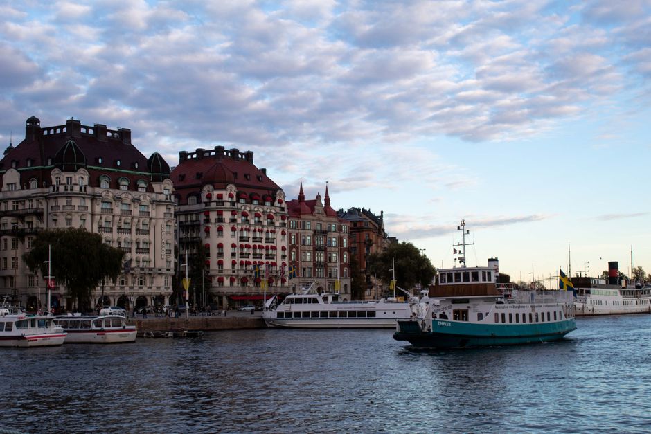 Charming cityscape of Stockholm's waterfront with iconic historical architecture and boats.